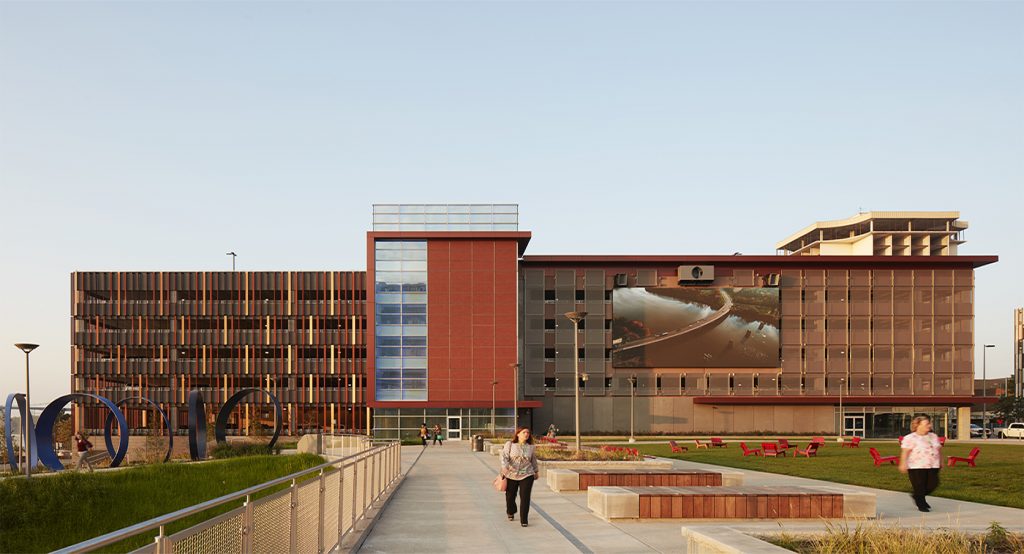 ProMedia HQ parking structure with plaza in front