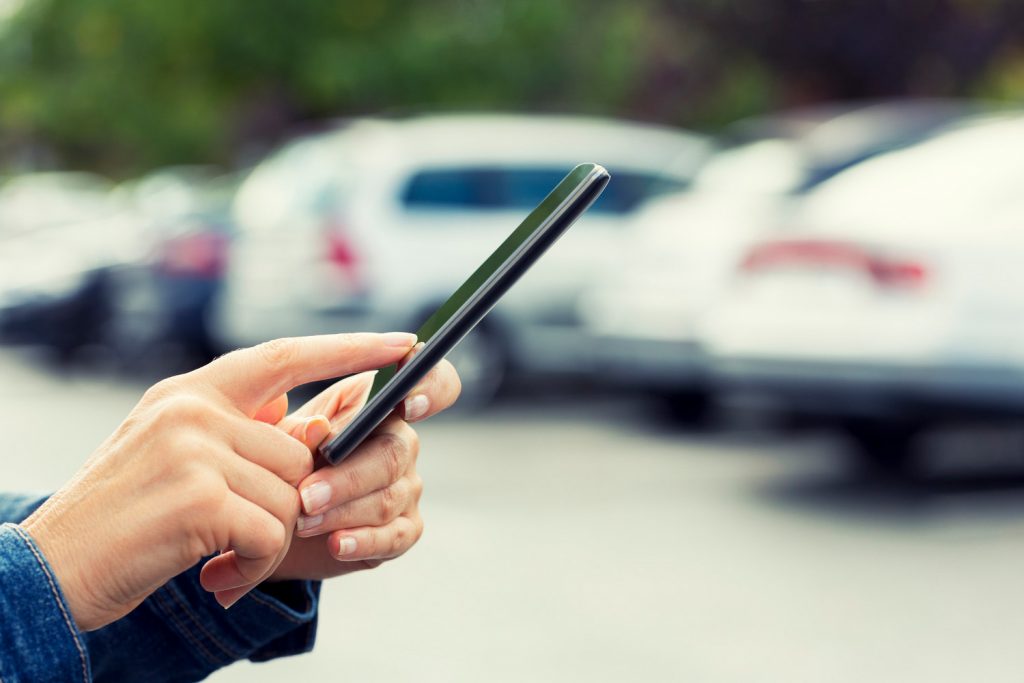 Using a smartphone in a parking lot