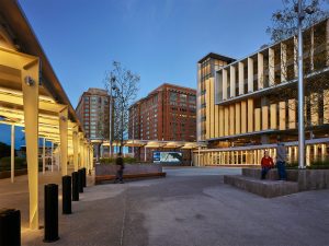 Pedestrian plaza in front of South Boston Waterfront Transportation Center at dusk