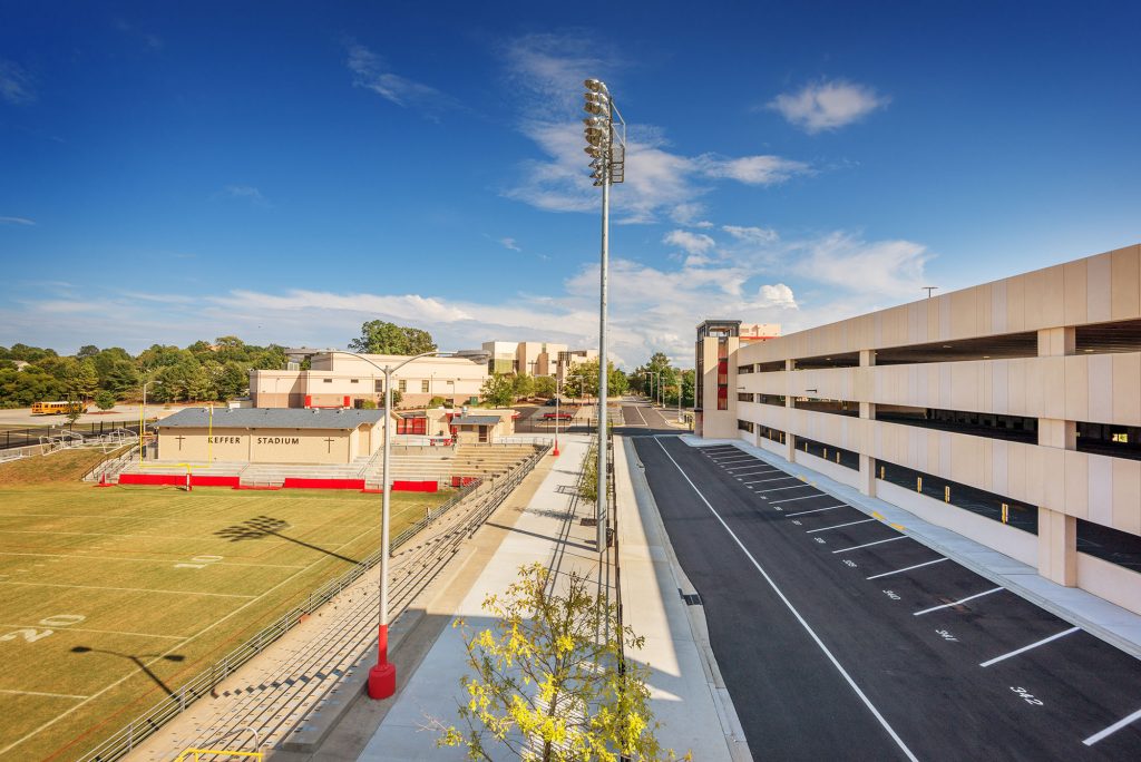 Exterior view of parking structure with adjacent football stadium