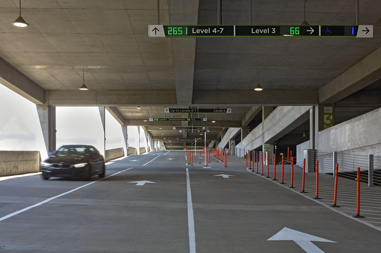 Express ramp connecting all floors of the ATL West Deck with space-available indicators above the access to each floor